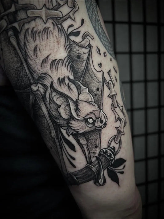 Big Blackwork Bat with Gothic Elements Tattoo on Men Arm by @bexpriesttattoos
