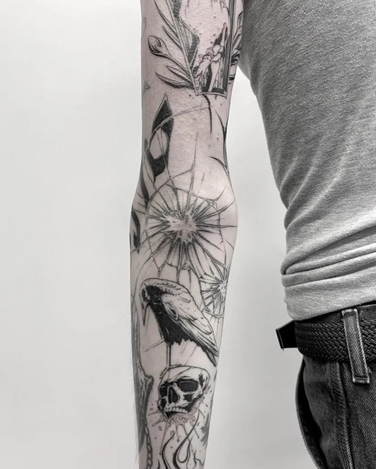 Big Blackwork Broken Glass Skull Bird Tattoo on Men Elbow by @karol.jewdoszuk
