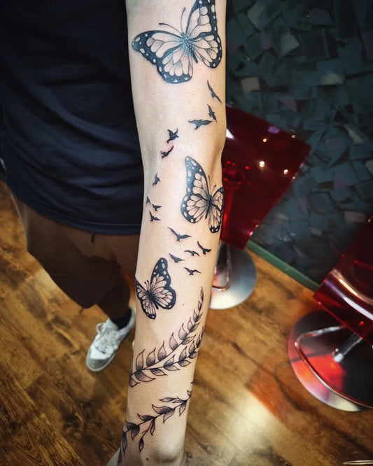 Big Blackwork Butterflies and Vines on Women Forearm Tattoo by @lotustattooalytus