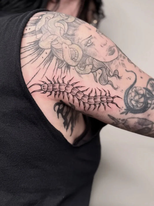 Big Blackwork Centipede Medusa Tattoo on Women Upper Arm by @inkedbyjuls