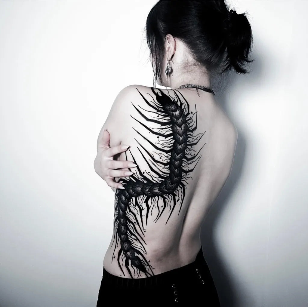 Big Blackwork Centipede Tattoo on Women Back by @noita.tattoo