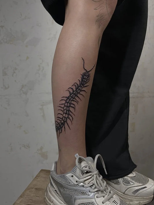 Big Blackwork Centipede Tattoo on Women Leg by @inechu.ttt