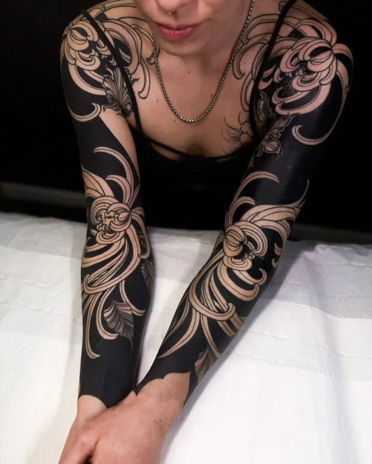 Big Blackwork Chrysanthemum Flowers in Black Sleeve Tattoo on Women Arm by @irezumiartist