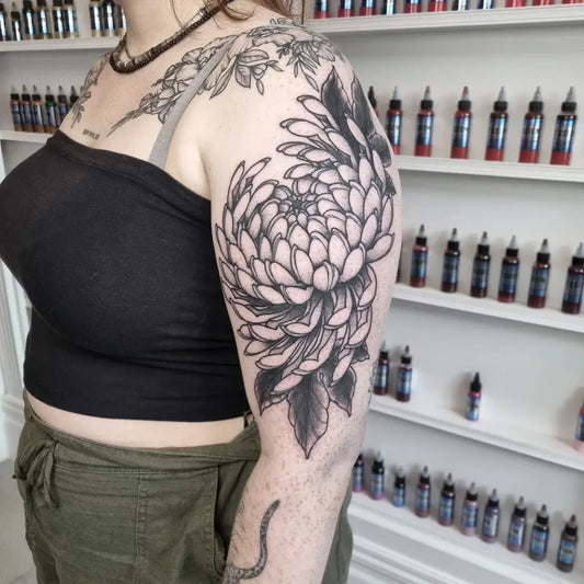Big Blackwork Chrysanthemum Tattoo on Women Bicep by @calumtattooer