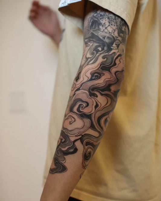 Big Blackwork Clouds and Waves Tattoo on Men Arm by @strokin_dark