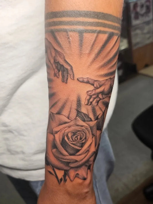 Big Blackwork Creation of Adam and Rose on Men Arm Religious Tattoo by @slug_tat2
