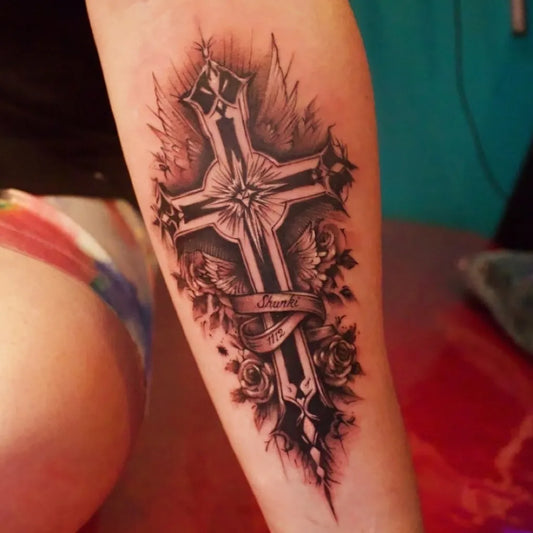 Big Blackwork Cross with Wings and Roses on Women Arm Tattoo by @ajito.osaka.tattoo