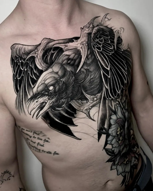 Big Blackwork Crow with Wings and Flowers Tattoo on Men Chest by @lorenzo_colore_tattoo
