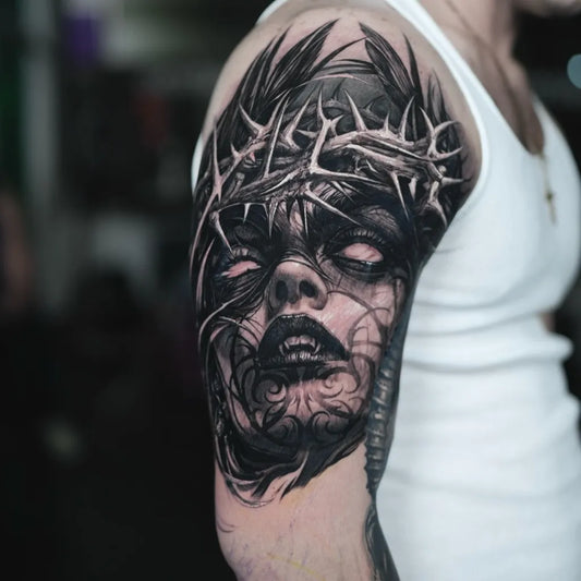 Big Blackwork Crown and Face Tattoo on Men Upper Arm by @tattoo_mel