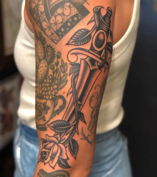 Big Blackwork Dagger Rose Tattoo on Women Arm by @idlehandsf