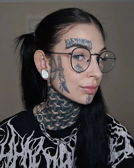 Big Blackwork Dagger on Women Face Tattoo by @itsthattattooedmum
