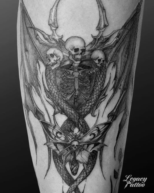 Big Blackwork Demon Wings Skulls Tattoo on Men Arm by @legacytatt