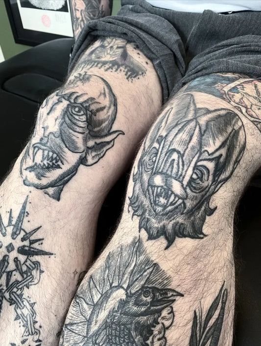 Big Blackwork Demonic Faces and Bird Tattoo on Men Knee by @maidstonejohn