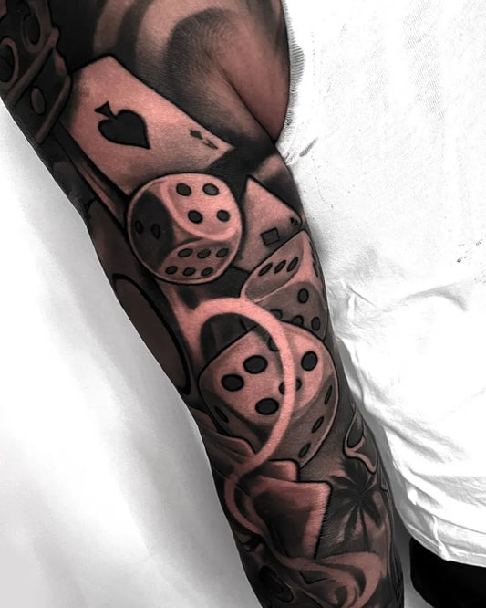 Big Blackwork Dice and Cards Tattoo on Men Arm by @will_tattoos