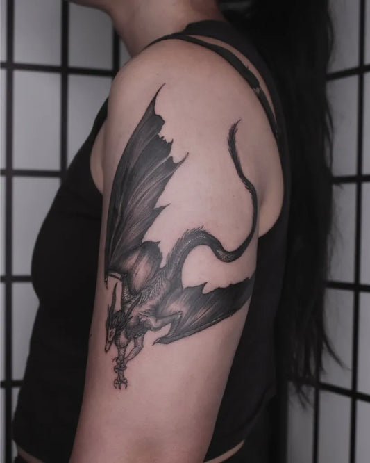 Big Blackwork Dragon Tattoo on Women Upper Arm by @wong_tattooer