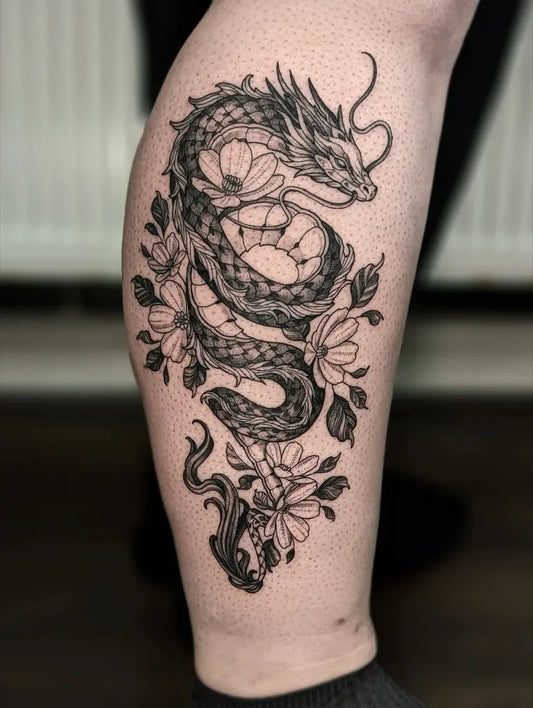Big Blackwork Dragon and Flowers on Women Thigh Tattoo by @maggiefoxart