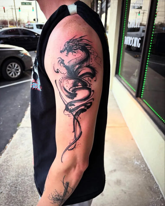 Big Blackwork Dragon on Men Arm Tattoo by @thefamilybusiness.ink