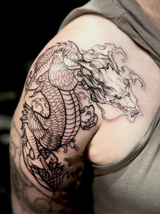 Big Blackwork Dragon on Men Shoulder Tattoo by @radchenko.arttattoo