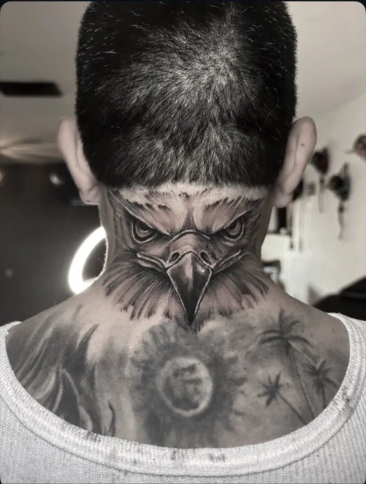 Big Blackwork Eagle with Sun and Palms Tattoo on Men Neck by @danilo.vivanco.tattoo