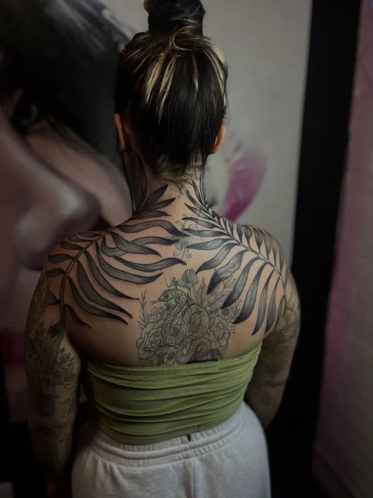 Big Blackwork Fern Leaves on Women Back Tattoo by @bobby_wonderful