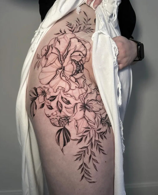 Big Blackwork Floral Bouquet Tattoo on Women Hip by @laura_jean_tattoo