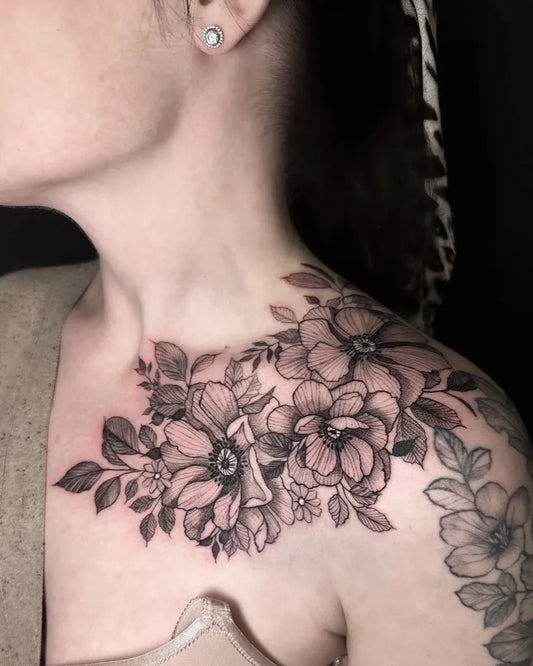 Big Blackwork Floral Bouquet on Women Shoulder Tattoo by @pocotattooleeds