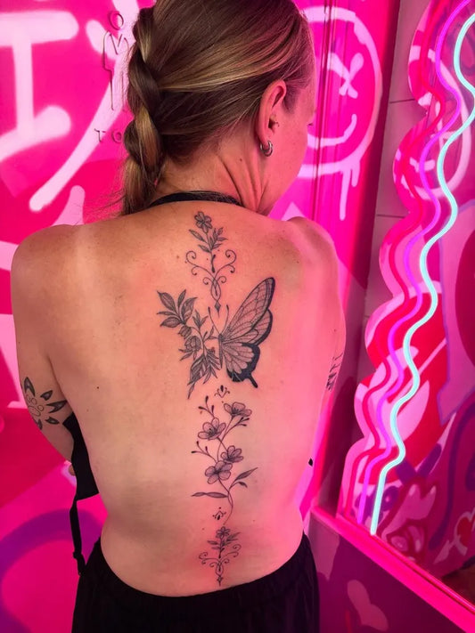 Big Blackwork Floral Butterfly on Women Back Tattoo by @scarlettfullertattoo