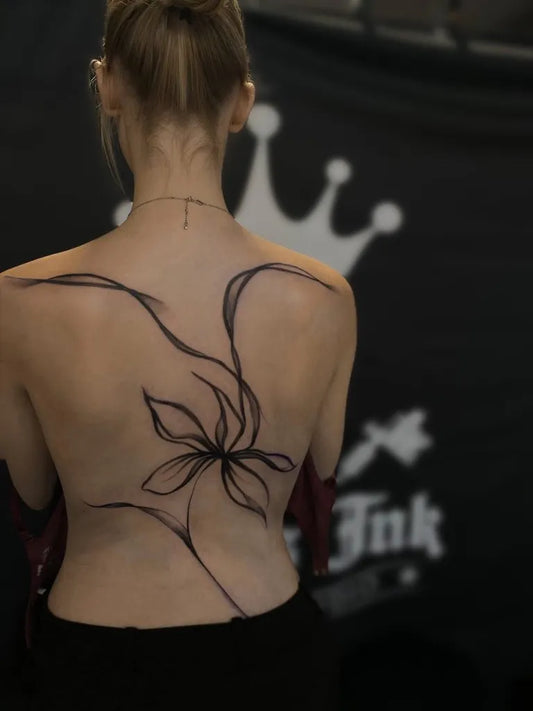Big Blackwork Flowers and Vines on Women Back Tattoo by @stones_ink_tattoo