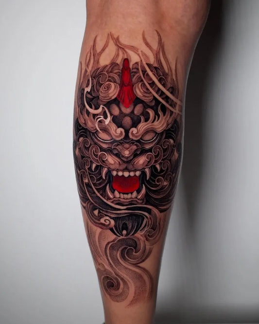 Big Blackwork Foo Dog Tattoo on Men Calf by @hoch_tattoo