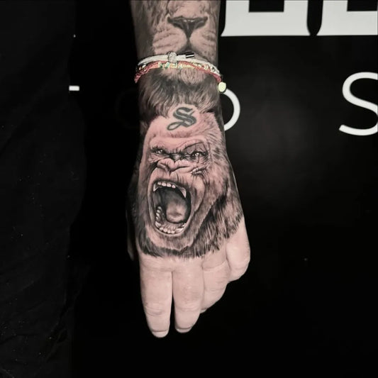 Big Blackwork Gorilla Tattoo on Men Hand by @aaronthetattooist