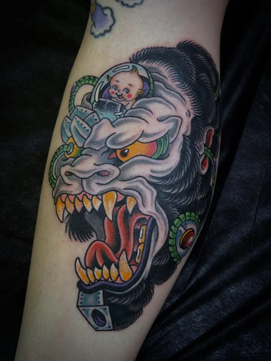 Big Blackwork Gorilla with Gear Helmet Tattoo on Men Arm by @lew.tattoos
