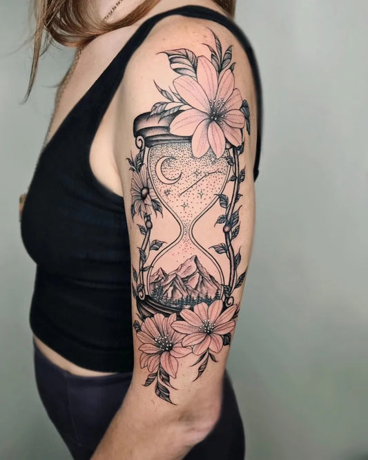 Big Blackwork Hourglass Flowers Tattoo on Women Arm by @tattsbytayy
