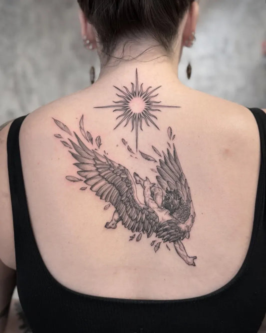Big Blackwork Icarus Wings and Sun on Women Back Tattoo by @hendon_art