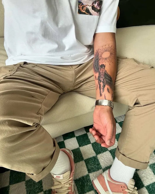 Big Blackwork Icarus and Sun on Men Arm Tattoo by @jessicamarietattoo