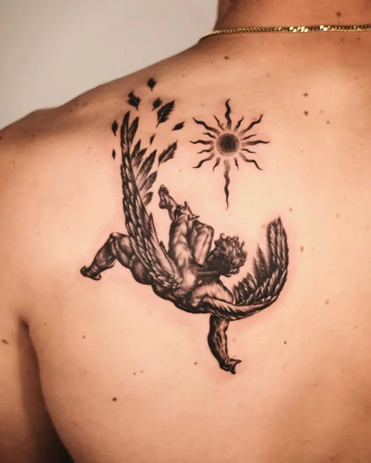 Big Blackwork Icarus with Sun and Wings on Men Back Tattoo by @bentattoo.sh