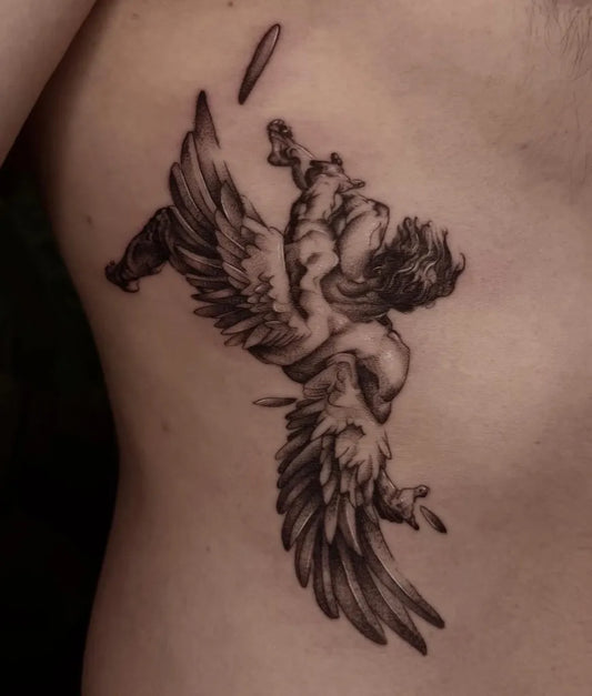 Big Blackwork Icarus with wings on Men Rib Tattoo by @vaughan_ink