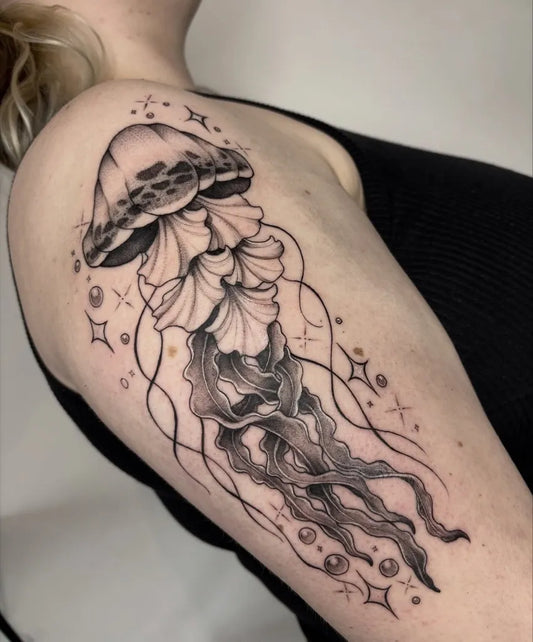 Big Blackwork Jellyfish with Stars Tattoo on Women Shoulder by @fioretattoos