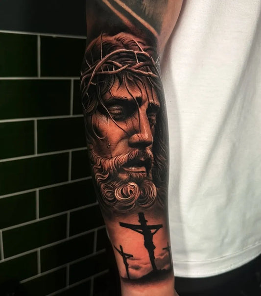 Big Blackwork Jesus Crosses on Men Arm Religious Tattoo by @jamie_fawky_tattoo