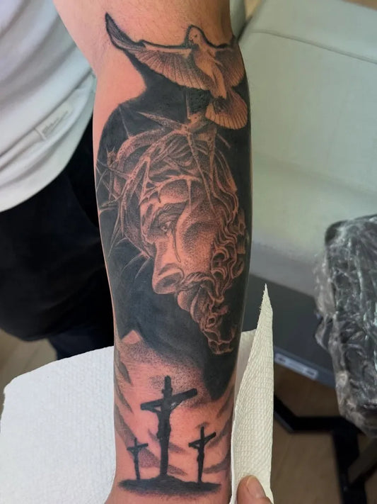 Big Blackwork Jesus Dove Crosses on Men Arm Religious Tattoo by @thewolfmantattoos