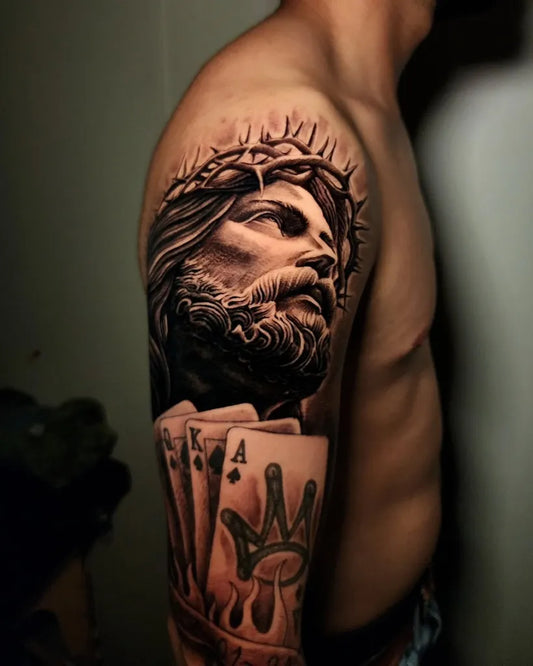 Big Blackwork Jesus with Crown of Thorns and Four Aces on Men Arm Religious Tattoo by @piolin_tatt2