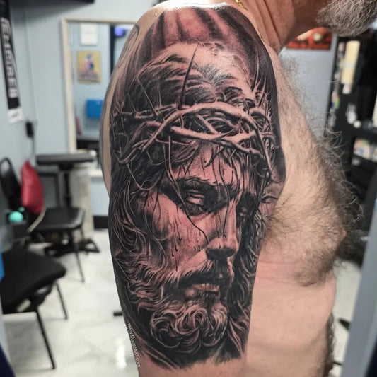 Big Blackwork Jesus with Crown of Thorns on Men Arm Religious Tattoo by @rupintart_com