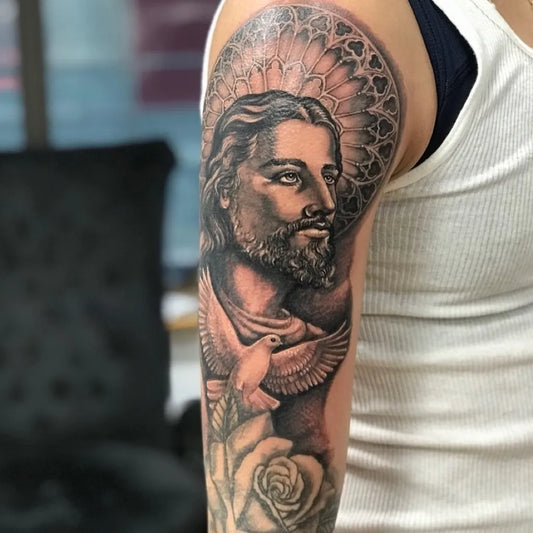 Big Blackwork Jesus with Dove and Rose on Men Arm Religious Tattoo by @artinktattoostudionyc