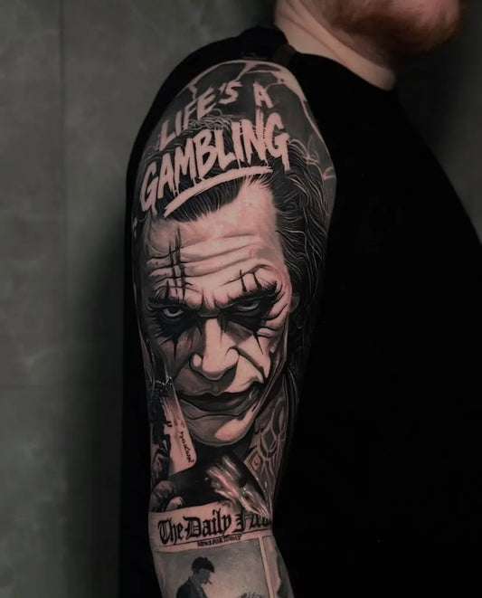 Big Blackwork Joker Gambling Men Arm Tattoo by @oasis.tattoobcn