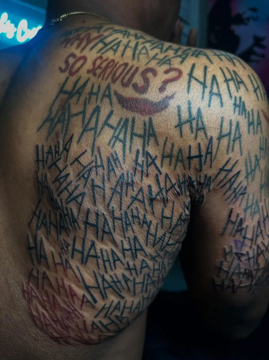 Big Blackwork Joker Laugh Text on Men Back Tattoo by @hannahscustoms