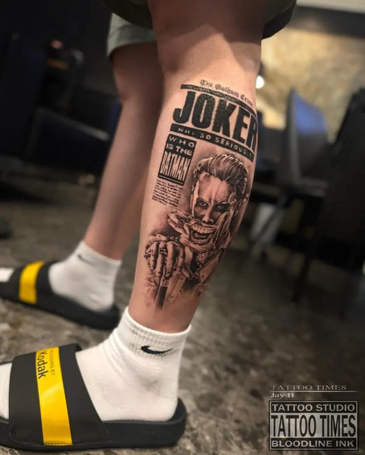 Big Blackwork Joker portrait with newspaper on Men Leg Tattoo by @tattoo.times