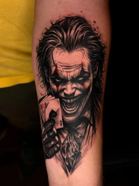 Big Blackwork Joker with Cards on Men Arm Tattoo by @roomcraft.tattoo