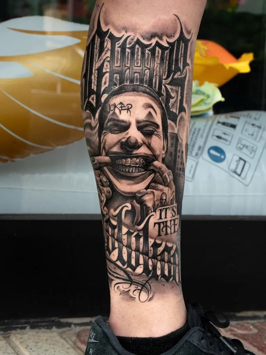 Big Blackwork Joker with Chicano Script on Men Leg Tattoo by @p.gtattooartist