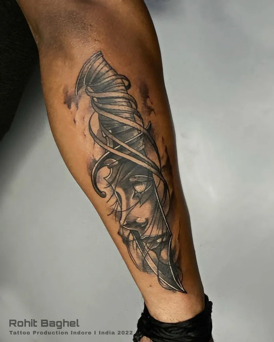 Big Blackwork Knife and Feather Tattoo on Men Leg by @tattoo_production_india