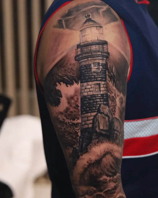Big Blackwork Lighthouse with Waves on Men Arm Tattoo by @manuartink