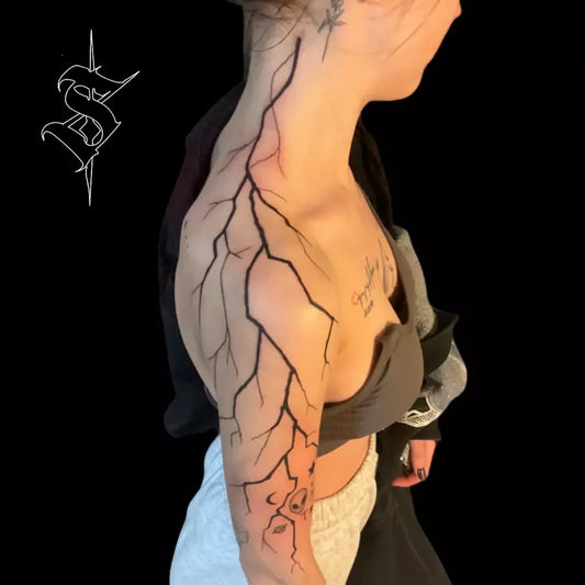 Big Blackwork Lightning Bolts Tattoo on Women Upper Arm by @szasza_tattoo